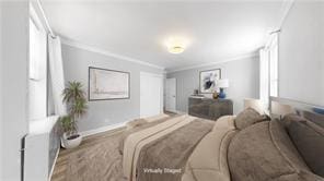 bedroom with crown molding and baseboards