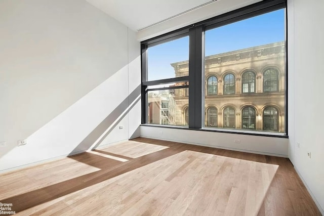 empty room featuring hardwood / wood-style flooring