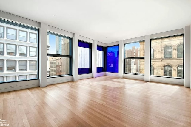 workout area with hardwood / wood-style floors and wooden walls