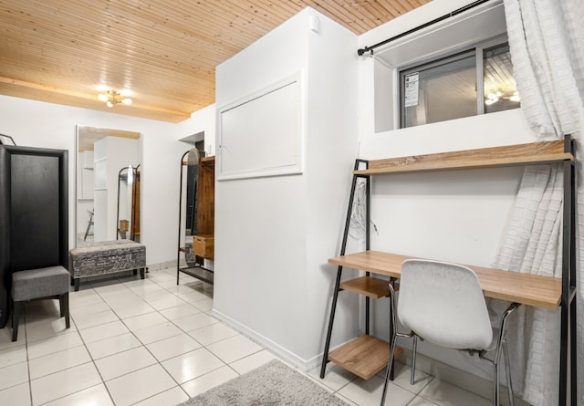 hall with light tile patterned floors and wood ceiling