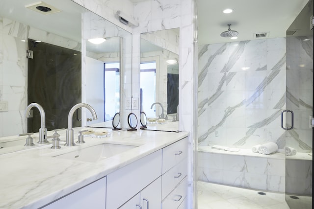 bathroom featuring vanity, visible vents, and a marble finish shower