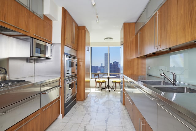 kitchen with sink and track lighting