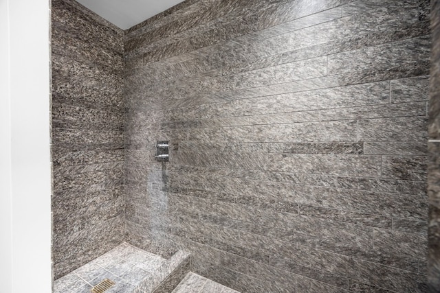 details featuring a tile shower