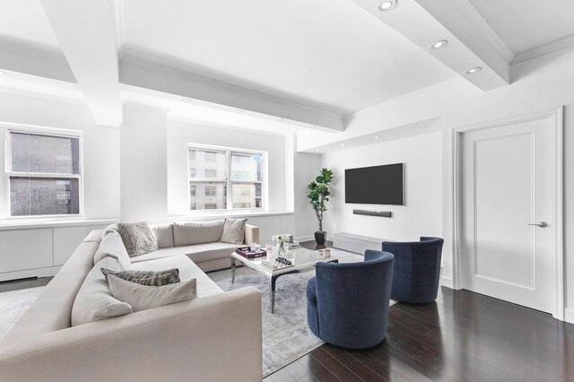 living room featuring hardwood / wood-style floors, beam ceiling, and beverage cooler