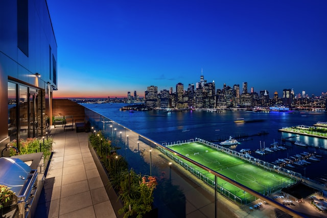 view of water feature with a city view