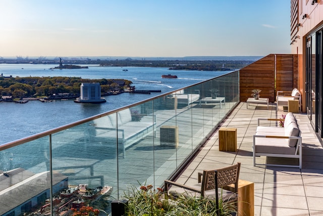 balcony featuring a water view