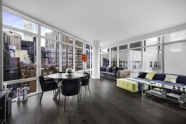 sunroom featuring a city view