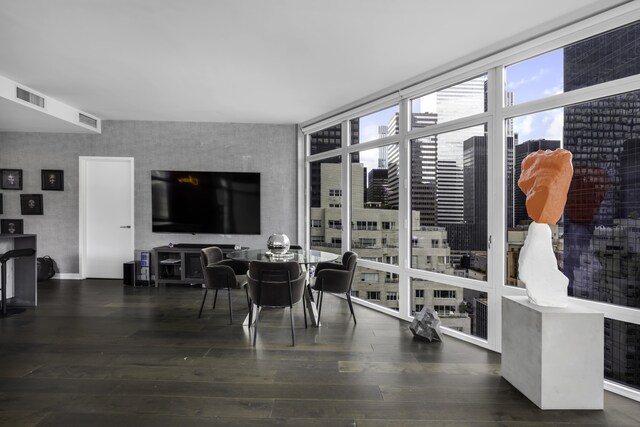 bedroom featuring beamed ceiling and dark hardwood / wood-style flooring