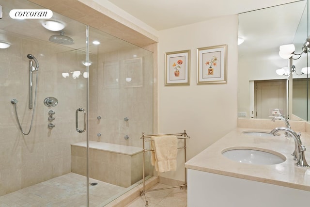 full bath with a sink, visible vents, double vanity, and a shower stall