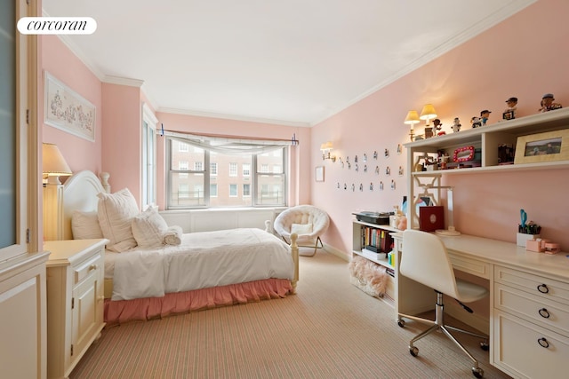 bedroom featuring carpet floors, visible vents, baseboards, built in desk, and crown molding