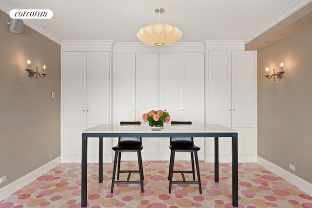 interior space featuring baseboards, visible vents, and crown molding