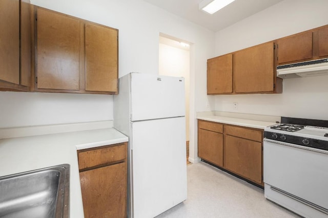 kitchen with sink and white appliances