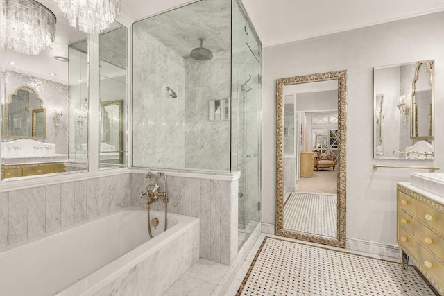 bathroom featuring a shower stall, crown molding, a bath, and vanity