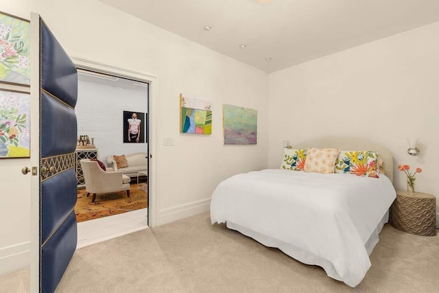 carpeted bedroom with baseboards