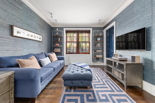 living area featuring ornamental molding, built in shelves, wood finished floors, and wallpapered walls