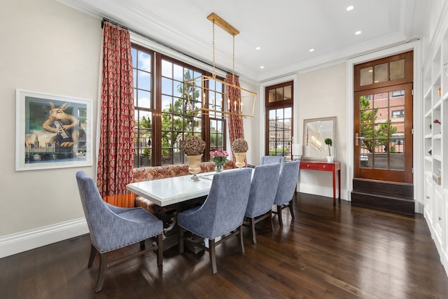 dining room featuring baseboards, a chandelier, recessed lighting, dark wood-style floors, and crown molding