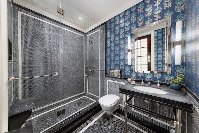 full bathroom featuring toilet, a stall shower, wallpapered walls, and vanity