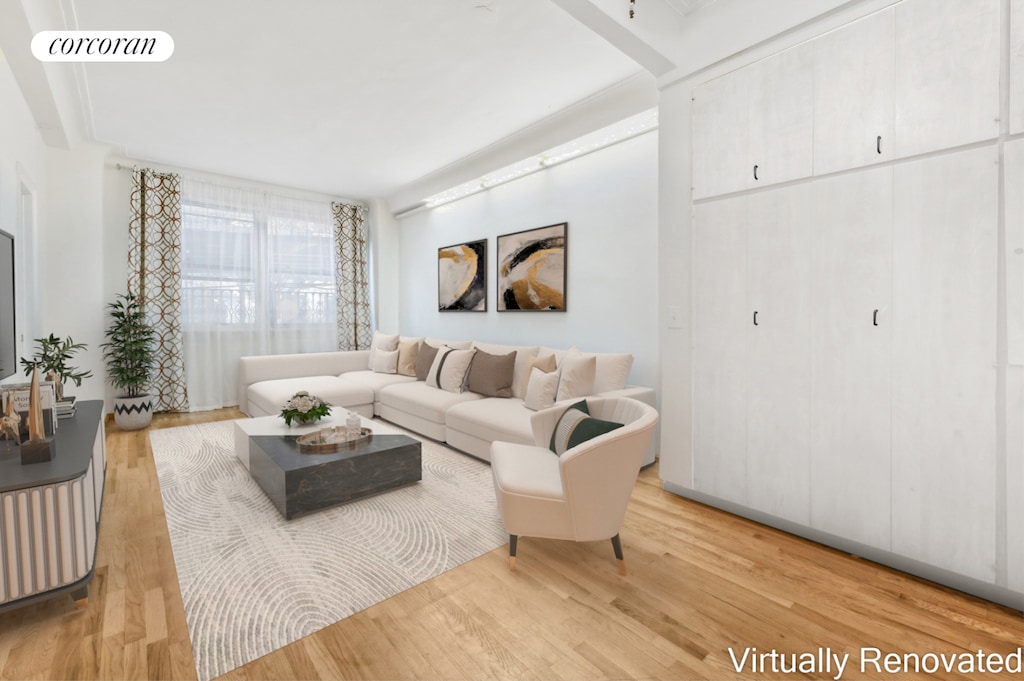 living room featuring light wood-type flooring and visible vents