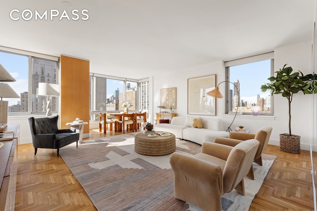 living area featuring a view of city and plenty of natural light