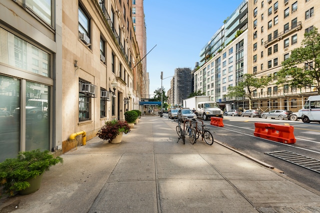 542 W 110th St, New York City, NY 10025 - view of asphalt road featuring street lighting, sidewalks, and a view of city