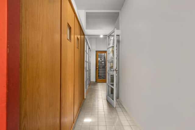 hallway featuring light tile patterned floors