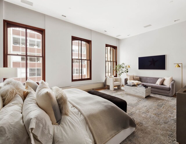 living room with a notable chandelier and light wood-type flooring