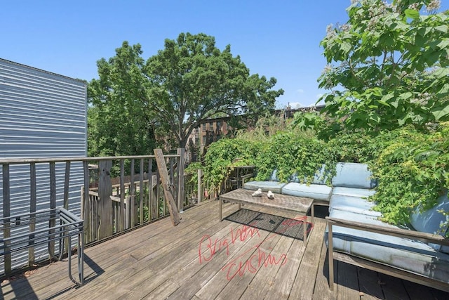 wooden deck featuring an outdoor living space