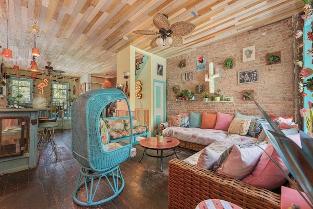 living room featuring wood ceiling, hardwood / wood-style flooring, ceiling fan, and brick wall