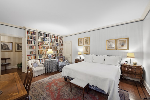 bedroom with crown molding and hardwood / wood-style flooring