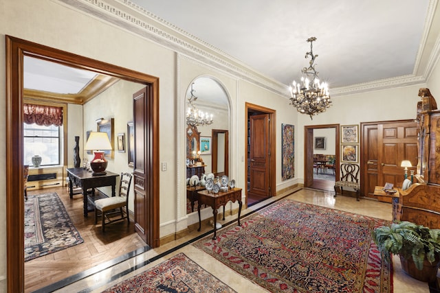 hallway featuring crown molding and a chandelier