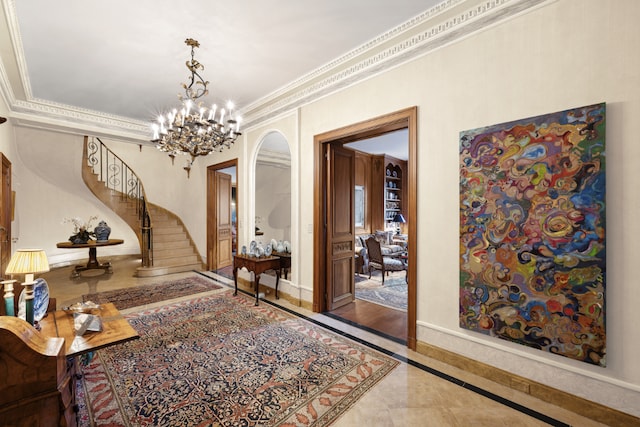 interior space featuring crown molding and an inviting chandelier