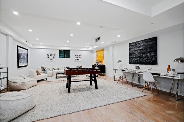 recreation room featuring light hardwood / wood-style floors