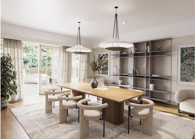 dining space with light hardwood / wood-style flooring