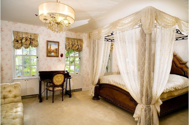 interior space featuring an inviting chandelier, carpet floors, and a wealth of natural light