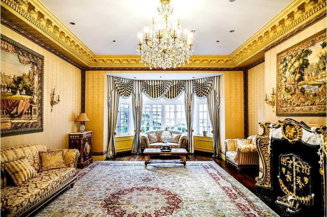 bedroom featuring crown molding, an inviting chandelier, and light hardwood / wood-style flooring