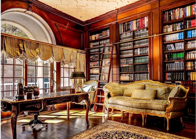 7 E 69th St, New York City, NY 10021 - living area featuring wood finished floors, built in shelves, and an office area