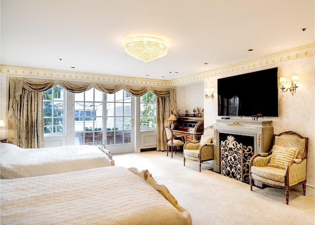 7 E 69th St, New York City, NY 10021 - carpeted bedroom featuring wallpapered walls, access to exterior, and a fireplace