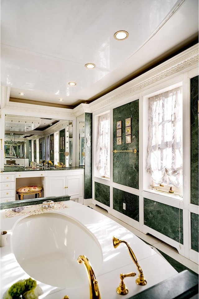 7 E 69th St, New York City, NY 10021 - bathroom with vanity, a garden tub, recessed lighting, and plenty of natural light