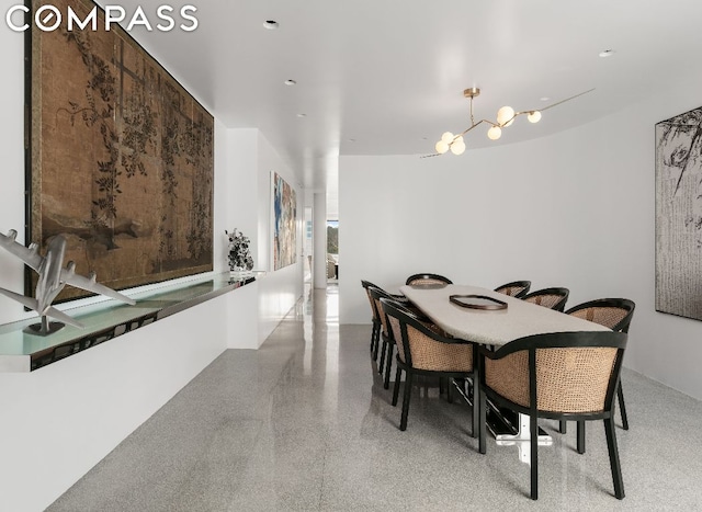 dining area with a notable chandelier