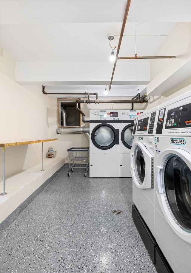 clothes washing area with washer and dryer