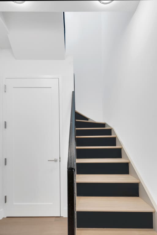 stairway featuring hardwood / wood-style flooring