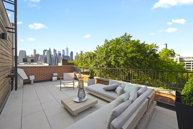 view of patio / terrace featuring an outdoor living space and a view of city