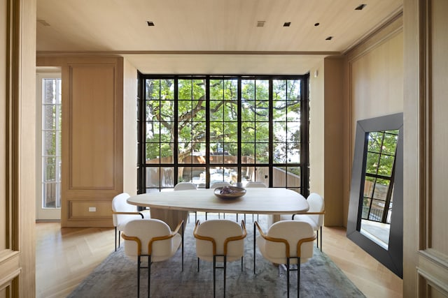dining space with wooden ceiling and plenty of natural light