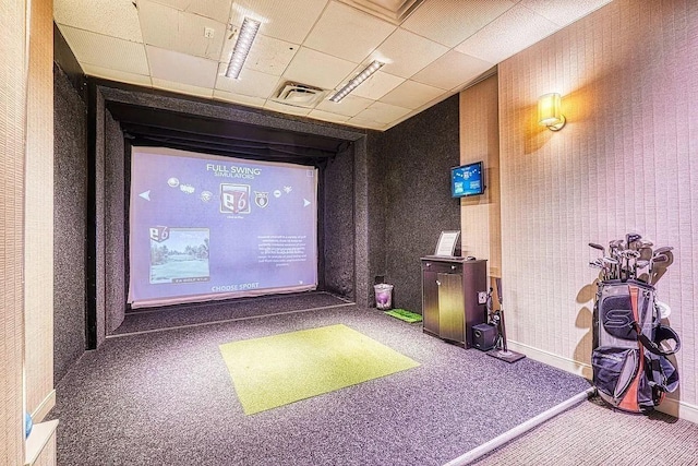 cinema room featuring golf simulator, carpet floors, visible vents, baseboards, and wallpapered walls