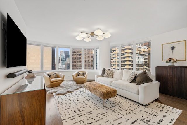 living area with light wood-style flooring and a city view