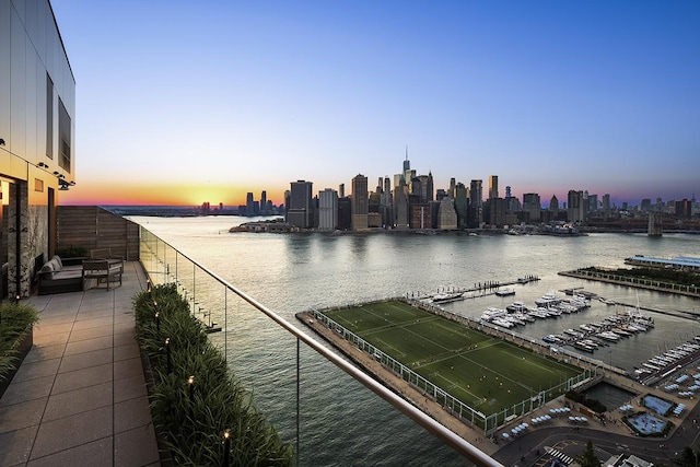 water view featuring a skyline view and a marina