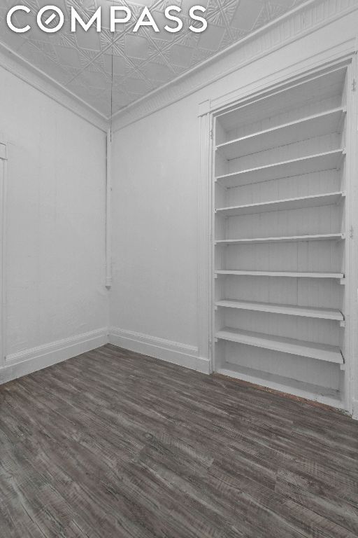 empty room featuring dark hardwood / wood-style flooring