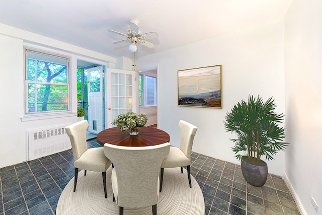 dining space with radiator heating unit and ceiling fan