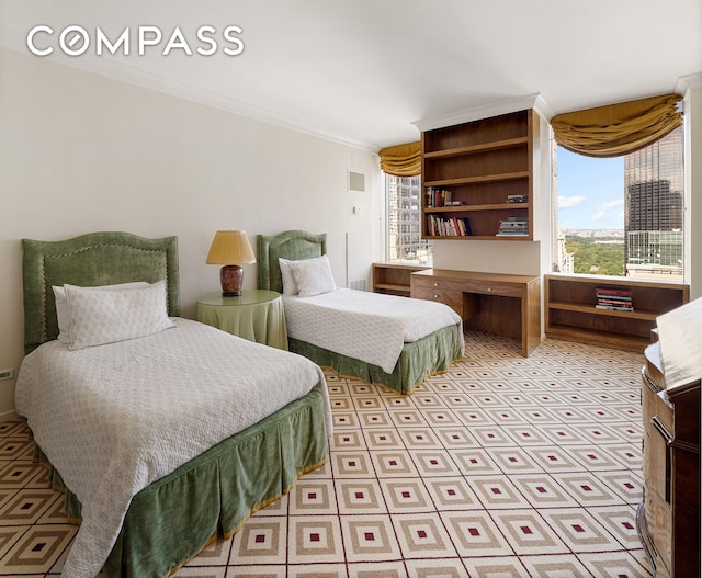 bedroom featuring visible vents and crown molding