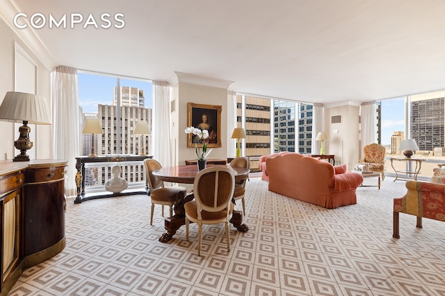 dining space with floor to ceiling windows, a view of city, and a healthy amount of sunlight